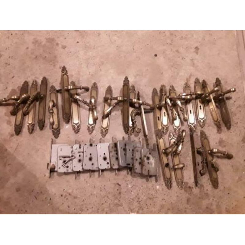 11 stel deurkrukken en sloten koper